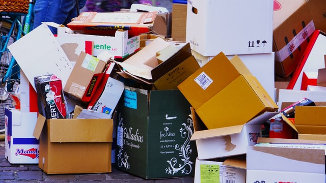 Pile of cardboard boxes left on a city sidewalk